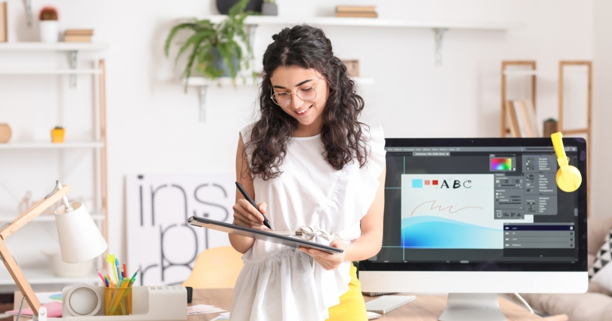Graphic designer working on branded visual content, representing the benefits of professional graphic design compared with AI-generated imagery.